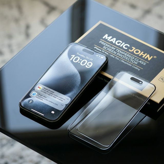 Magic John premium tempered glass screen protectors displayed with iPhone packaging